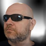 man with beard using glasses