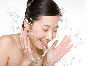 woman washing face