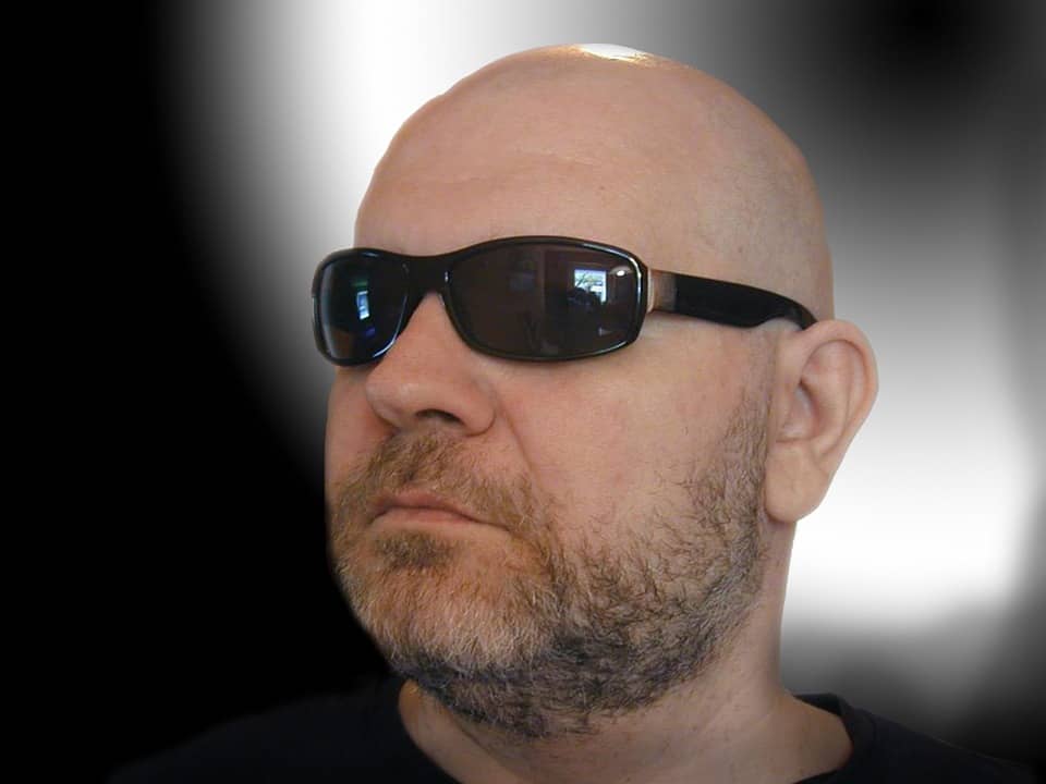 man with beard using glasses